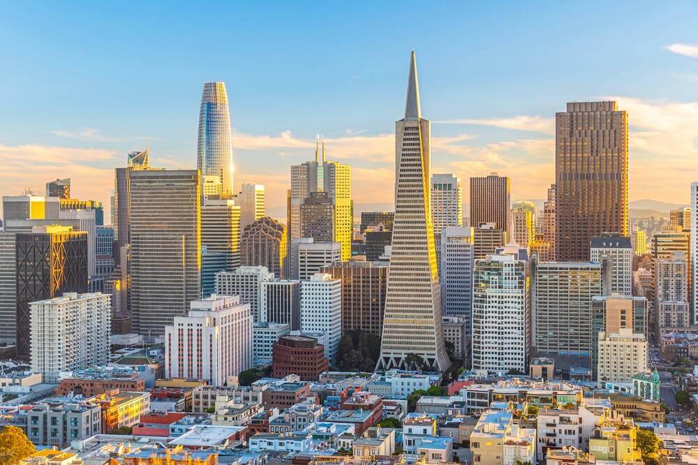 Insurance franchises in California with a view of the San Francisco skyline.